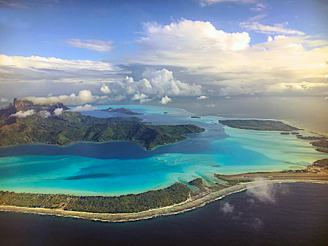 Flying above the atoll of Bora Bora. French Polynesia, South Pacific Ocean.