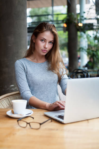 istock a pretty woman sitting behind her laptop 1066665410