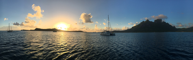 Sunset panorama from the lagoon at the island of Bora Bora. French Polynesia, South Pacific Ocean.