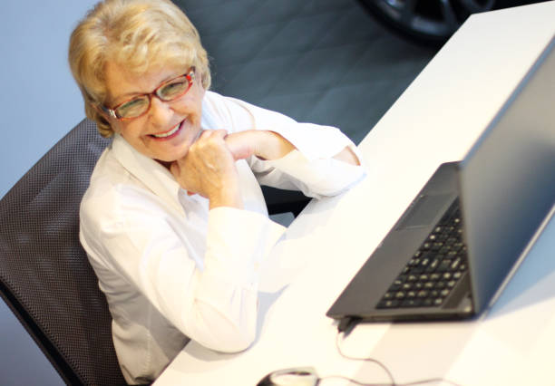 istock Older woman at the office 1066670214
