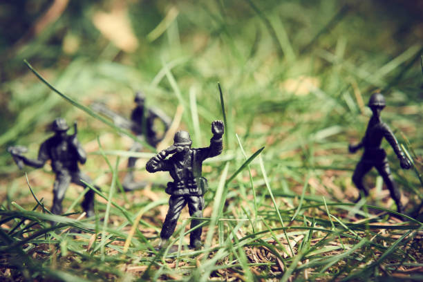 istock Toy soldiers in jungle fighting. 1066670606