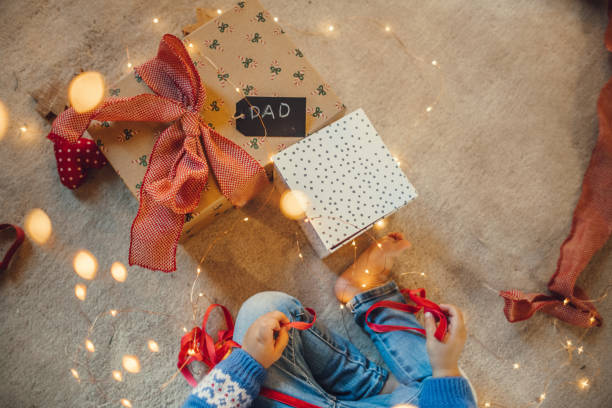 istock Kids wrapping christmas gifts 1066672216