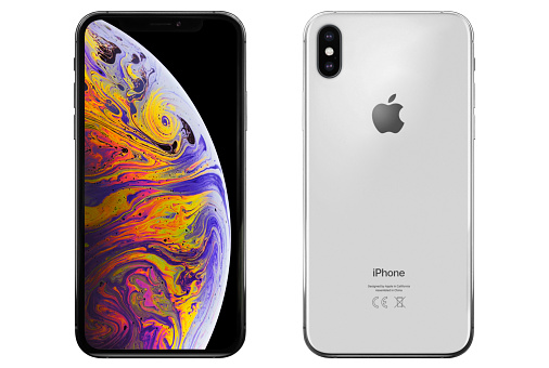 Studio shot of a silver color iPhone XS Max smart phone. Front and back view. 6.5 inch Super Retina HD display and 1242 x 2688 pixels resolution. It is a smart phone produced by Apple Computers Inc and released in 2018, October. Isolated on white.