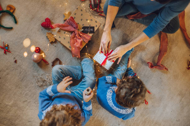 istock Kids wrapping christmas gifts 1066672438