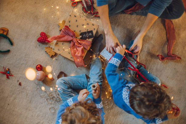 istock Kids wrapping christmas gifts 1066672674