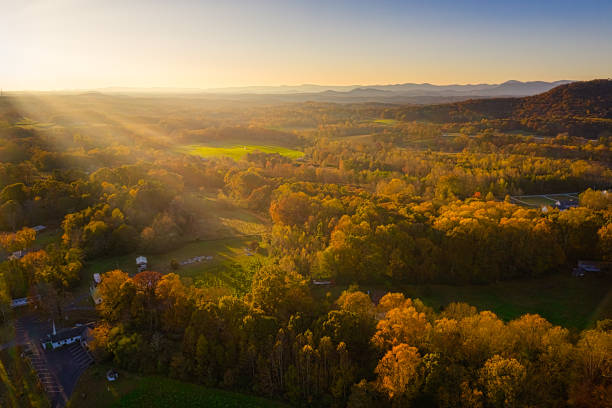 Aerial view of golden hour sunset in Georgia Mountains with sun rays stock photo