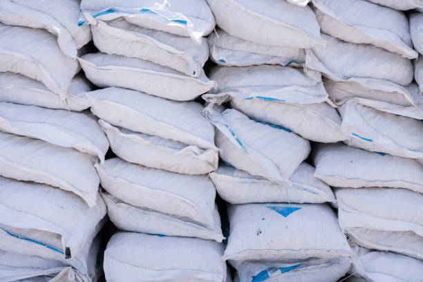 istock Stacks of cement bags, closeup 1066673650
