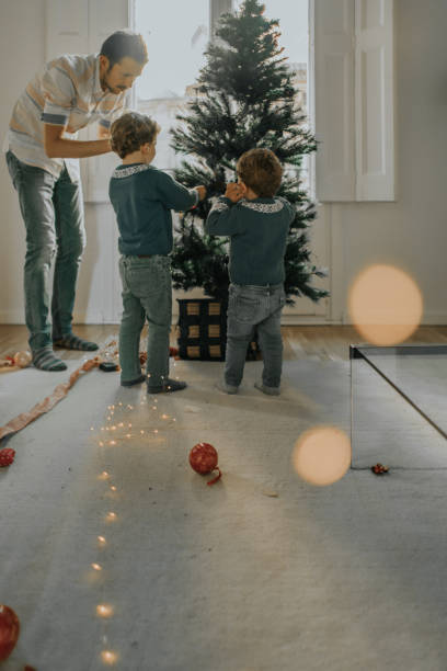 istock Family decorating Christmas tree 1066677564