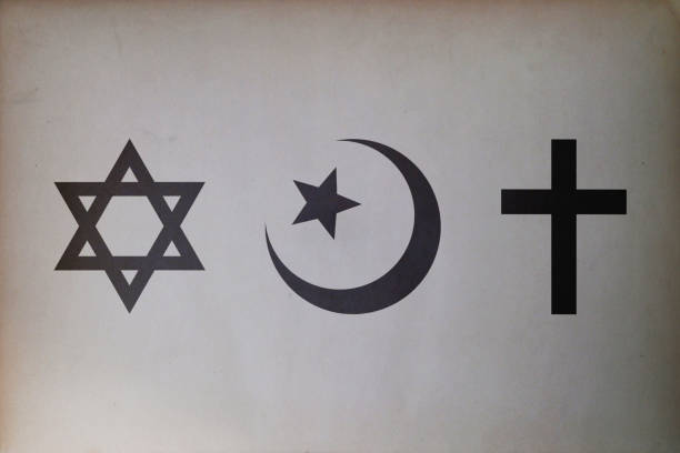 istock Abrahamic symbols (Judaism, Islam and Christianity) printed on paper 1066678452