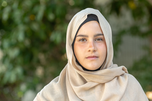 Serious young middle eastern muslim woman looking at the camera