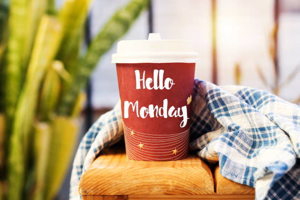 istock text HELLO MONDAY on cup of aromatic coffee on wooden table 1066682354