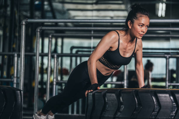 istock Athletic Woman Workout At The Gym 1066683404