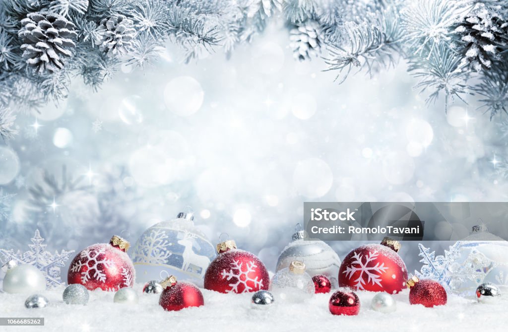 Merry Christmas - Baubles On Snow With Fir Branches Baubles On Snow With Snowy Christmas Tree Christmas Stock Photo