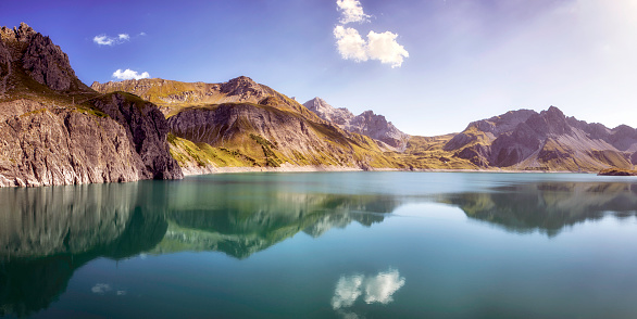 The Lünersee in Voralberg (Austria) is one of the most beautiful mountain lakes in the entire Alpine region.

A walk around the lake is impressive. When you walk around and the sun shines you can see the surrounding mountains reflect in the clear blue water. Are you traveling in the Brandnertal or the region? Be sure to stop by at the Lünersee!