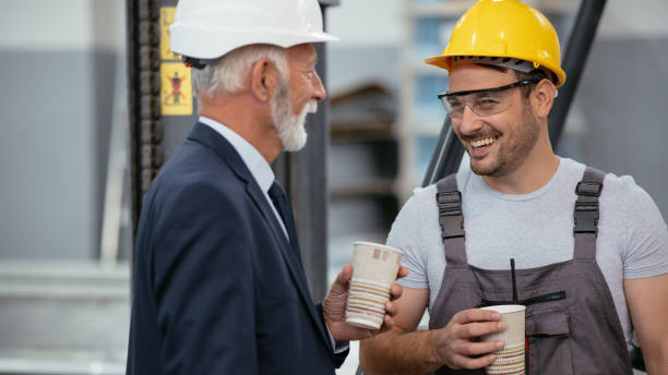 istock Factory worker and quality inspector in factory on a break 1066695382