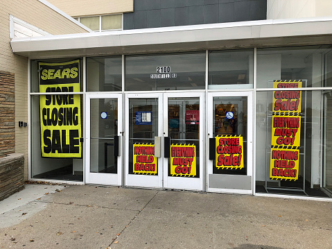 Lincoln Park, Michigan-November 8, 2018-Signs on a local Sears store indicating they are going out of business. Sears was once America's largest retailer.