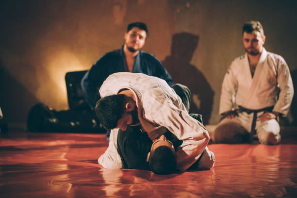 istock Jujitsu fighters fighting in the gym 1066701008