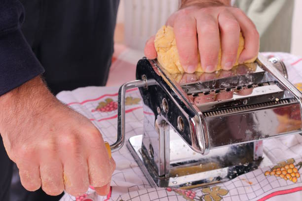 istock Making homemade pasta with pasta maker 1066705188