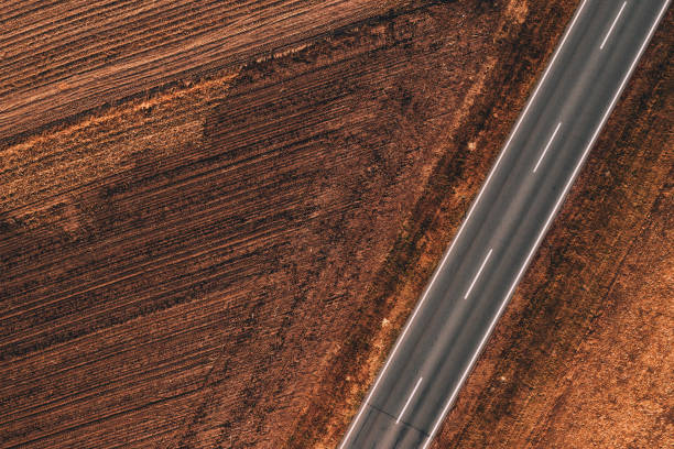 istock Aerial view of empty road through countryside 1066706780
