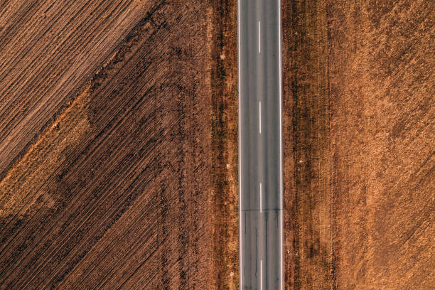 istock Aerial view of empty road through countryside 1066707824