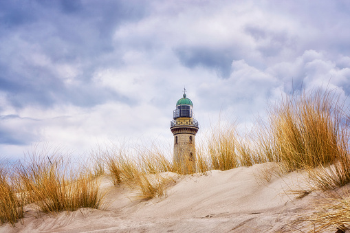 Dunes of Warnemünde with lighthouse.