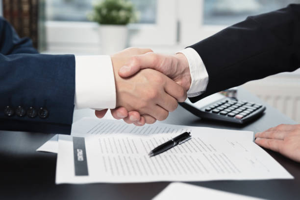istock Business contract. Business man shaking hands 1066710434