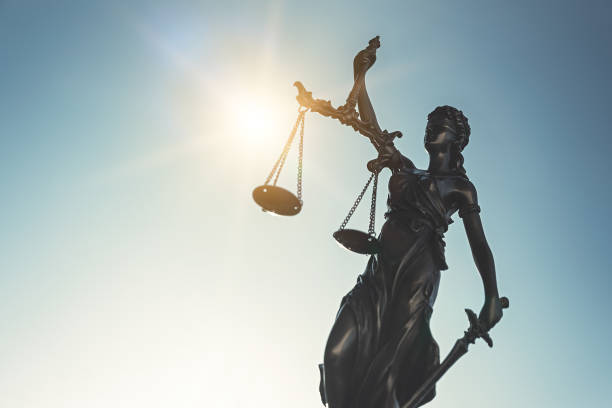 istock Lady justice. Statue of Justice, Themis on sky 1066711880