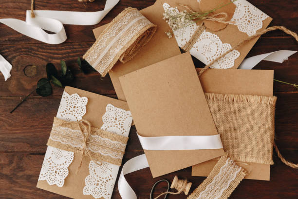 istock Handmade flat lay greeting card and envelope on wooden background for creative work design 1066719848