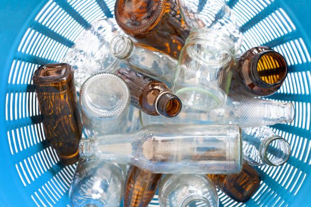 istock Glass bottles in waste basket. 1066722082