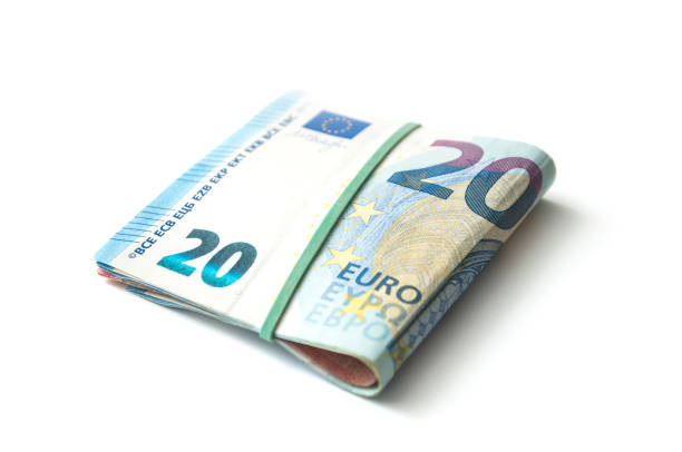 istock banknotes bundle of twenty euros money on white background 1066724710