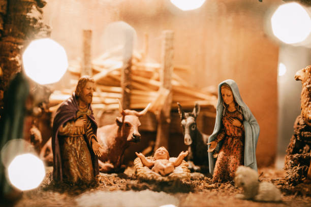 Christmas Nativity scene with baby Jesus in manger. Birth of Jesus Christ in Bethelehem with Mary and Joseph. Christmas background.