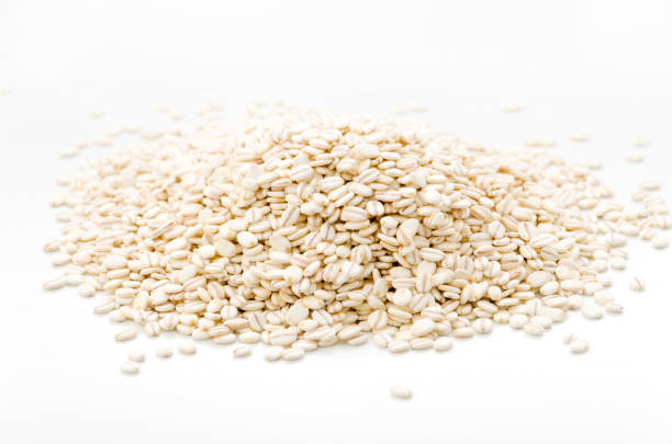 istock Heap of rolled barley isolated on white background 1066736620