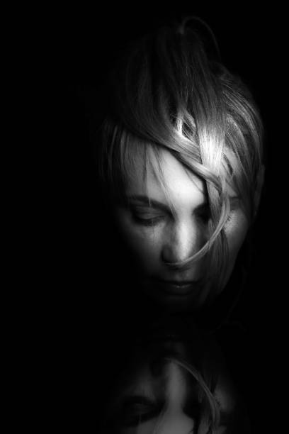 istock A woman looking in the mirror 1066736998