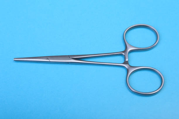 istock Close Up Surgical instruments and tools on blue mirror background. Selective focus. 1066744824