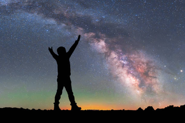 Man Looking Up The Milky Way Man Looking Up The Milky Way space milky way star night stock pictures, royalty-free photos & images