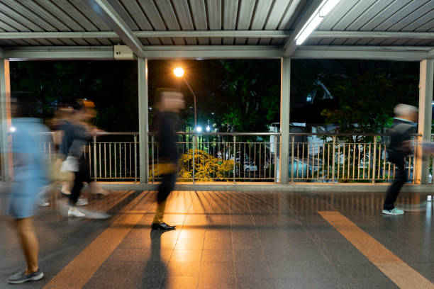 istock Blurry Traveler people walking on the bridge night scene 1066751054