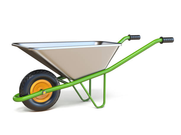 New orange wheelbarrow gardening and construction equipment in sunset lighting.