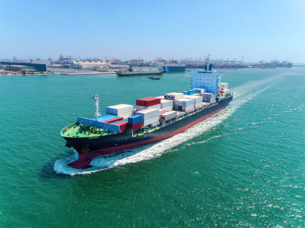 istock Aerial view container ship at sea port full load container for logistics import  export or transportation concept background. 1066762798