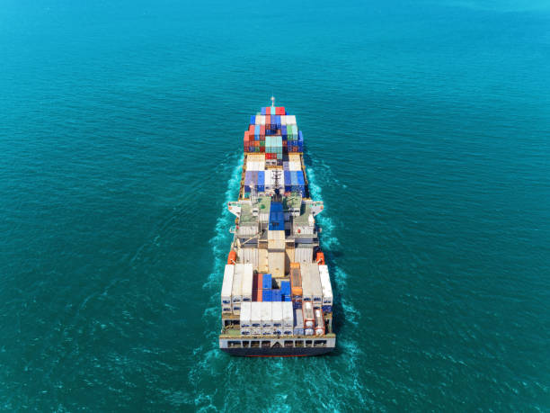 istock Aerial view container ship at sea full load container for logistics import  export or transportation concept background. 1066764576