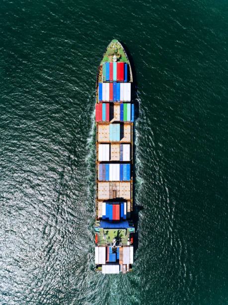 istock Aerial view container ship or carry ship with container in the sea for import  export logistics or transportation concept background. 1066764978