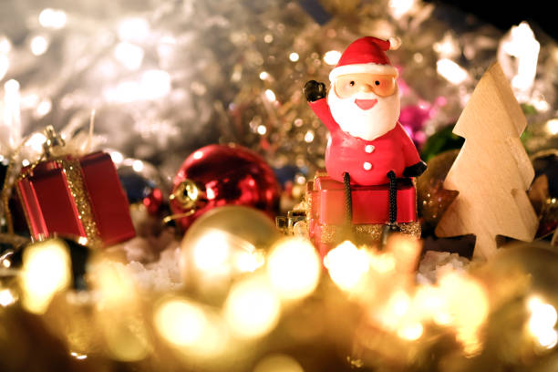 istock Santa Claus dolls and Christmas decorations on abstract light background with copy space 1066766820