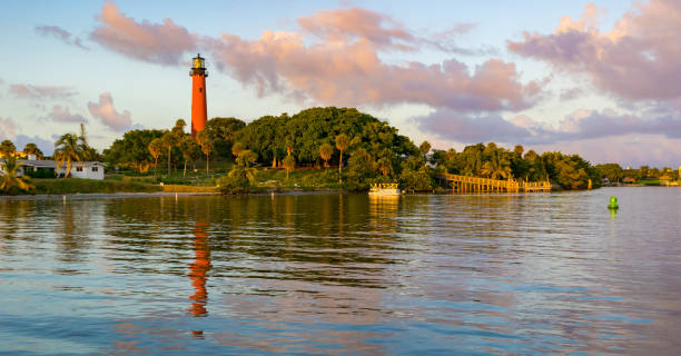 Jupiter Inlet Lighthouse Jupiter Inlet, Florida with the lighthouse at dusk. inlet photos stock pictures, royalty-free photos & images
