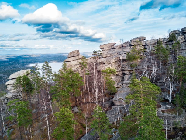 istock Aerial; drone view of steep stone cliff; high mountaine range, Ural 1066788092