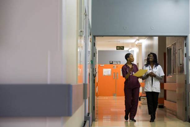 istock Female Doctors discussing patients records 1066788138