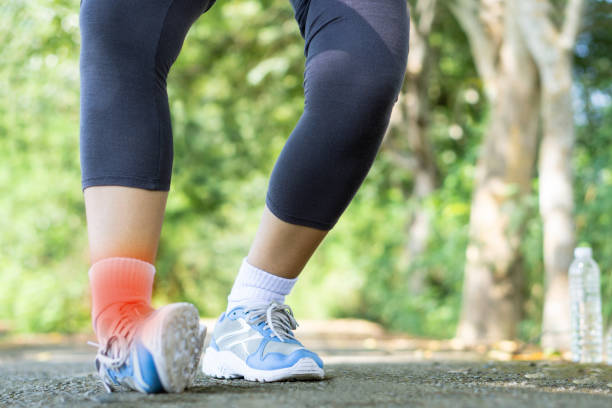 istock female runner having leg pain or broken twisted ankle during doing sport 1066796782