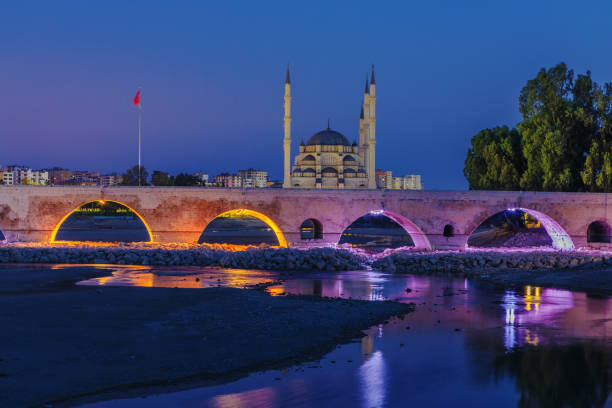 Stone Bridge (Taskopru) and Sabanci Central Mosque in Adana, Turkey stock photo