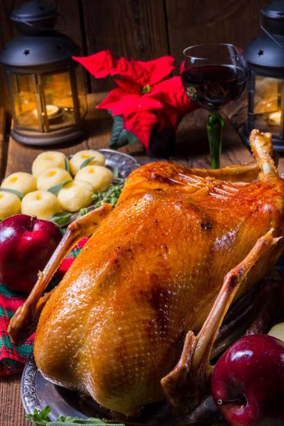 istock festive stuffed roast goose with red cabbage and dumplings 1066805332