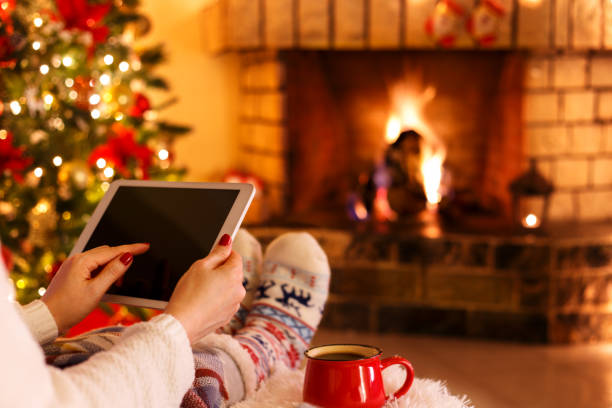 istock Woman sitting by fireplace 1066828442