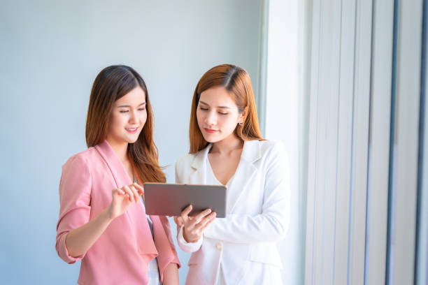 istock Business team is discussing on tablet in team meeting 1066830874