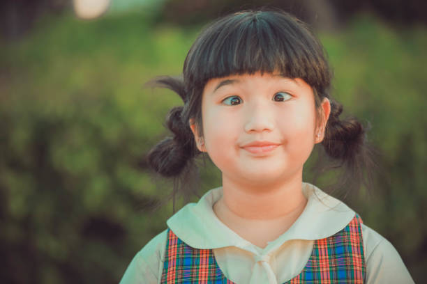 istock Little girl making a funny face 1066831444